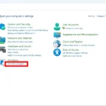 Mũi tên đỏ chỉ vào 'Programs' và viền đỏ quanh 'Uninstall a program' trong Control Panel trên Windows
