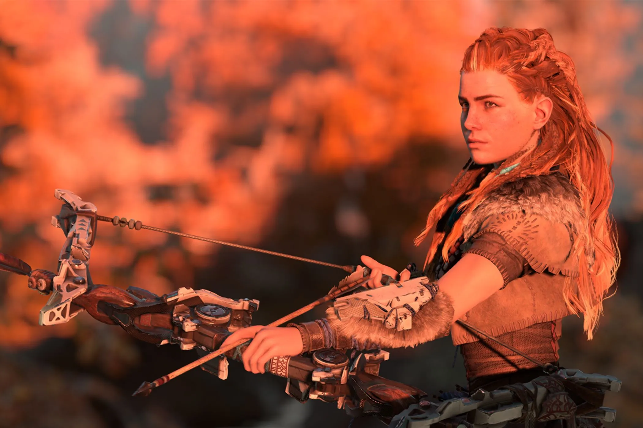 Aloy, nữ thợ săn biểu tượng của Horizon Zero Dawn, cầm cung trong ánh hoàng hôn, tượng trưng cho thành công của game chơi đơn trên PlayStation.