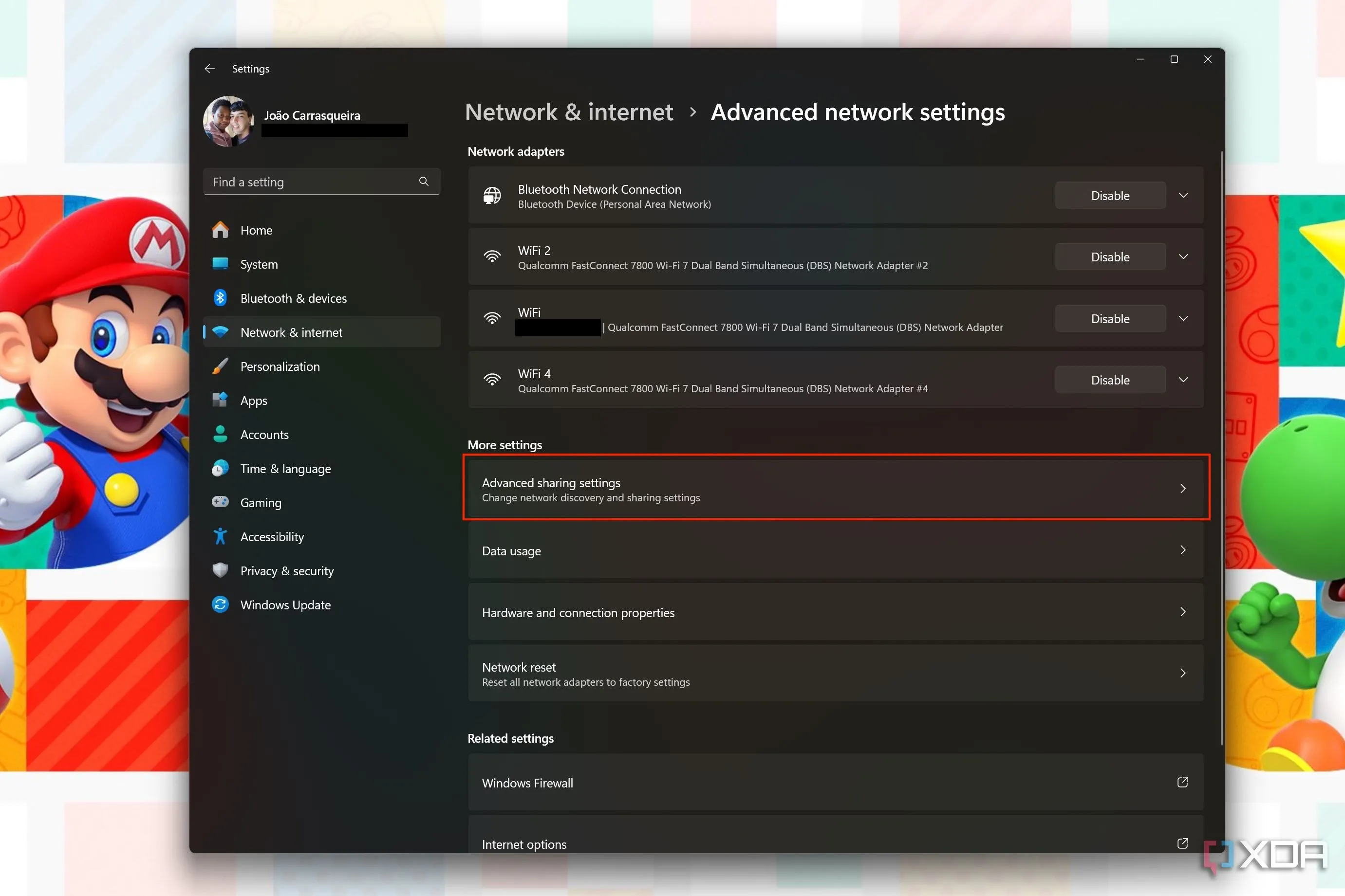 Ảnh chụp màn hình cài đặt mạng nâng cao Windows 11 với nút &quot;Cài đặt chia sẻ nâng cao&quot; được tô sáng