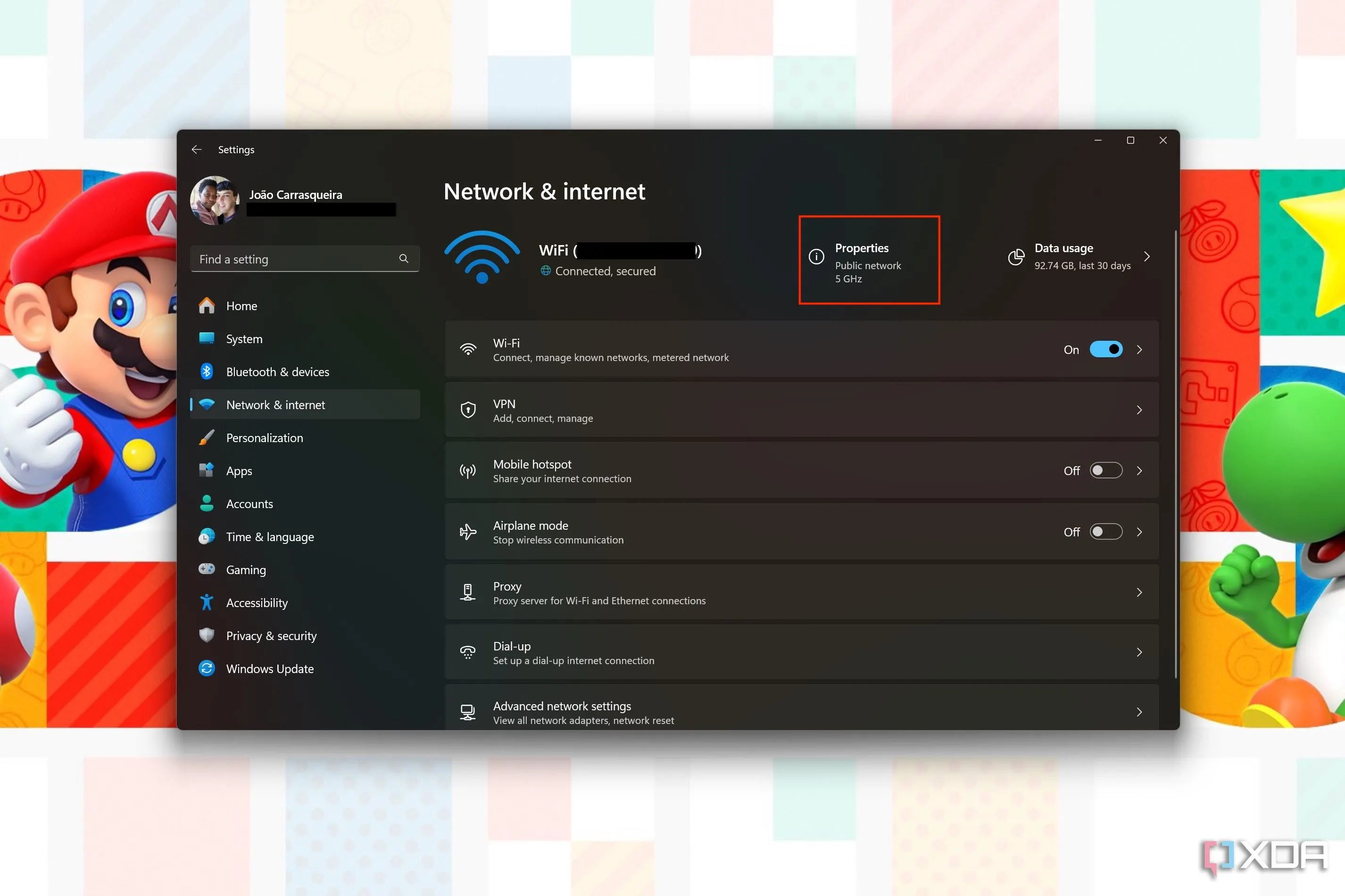 Ảnh chụp màn hình Cài đặt mạng Windows 11 với nút &quot;Thuộc tính&quot; được tô sáng, cho biết trạng thái mạng là công cộng hoặc riêng tư