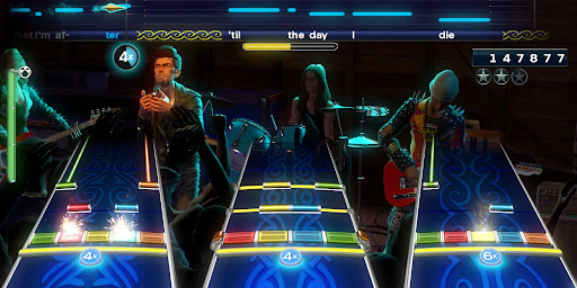 Bốn người chơi trình diễn với nhạc cụ giả lập trong game Rock Band 4 trên Xbox One