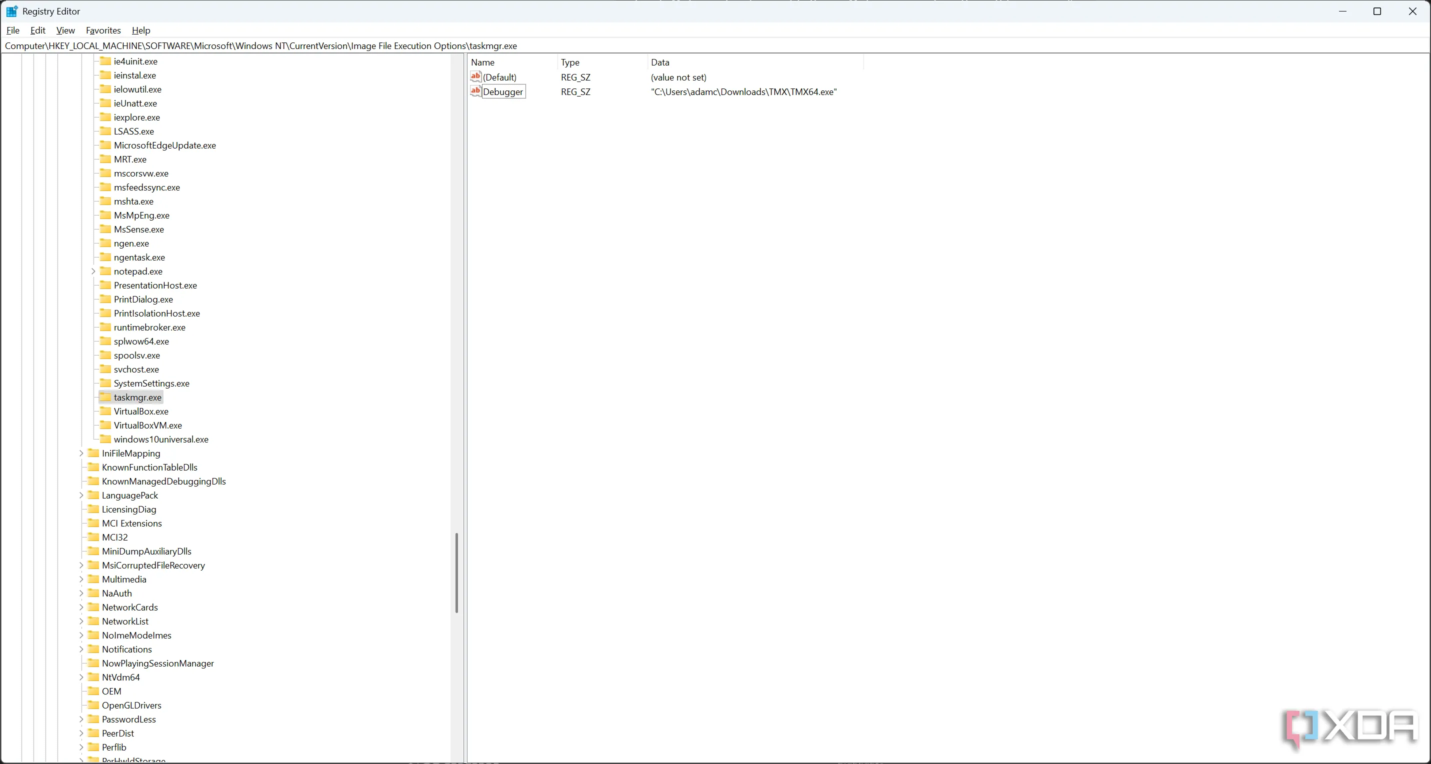 Cửa sổ Registry Editor hiển thị việc chỉnh sửa giá trị Debugger để thay thế Task Manager