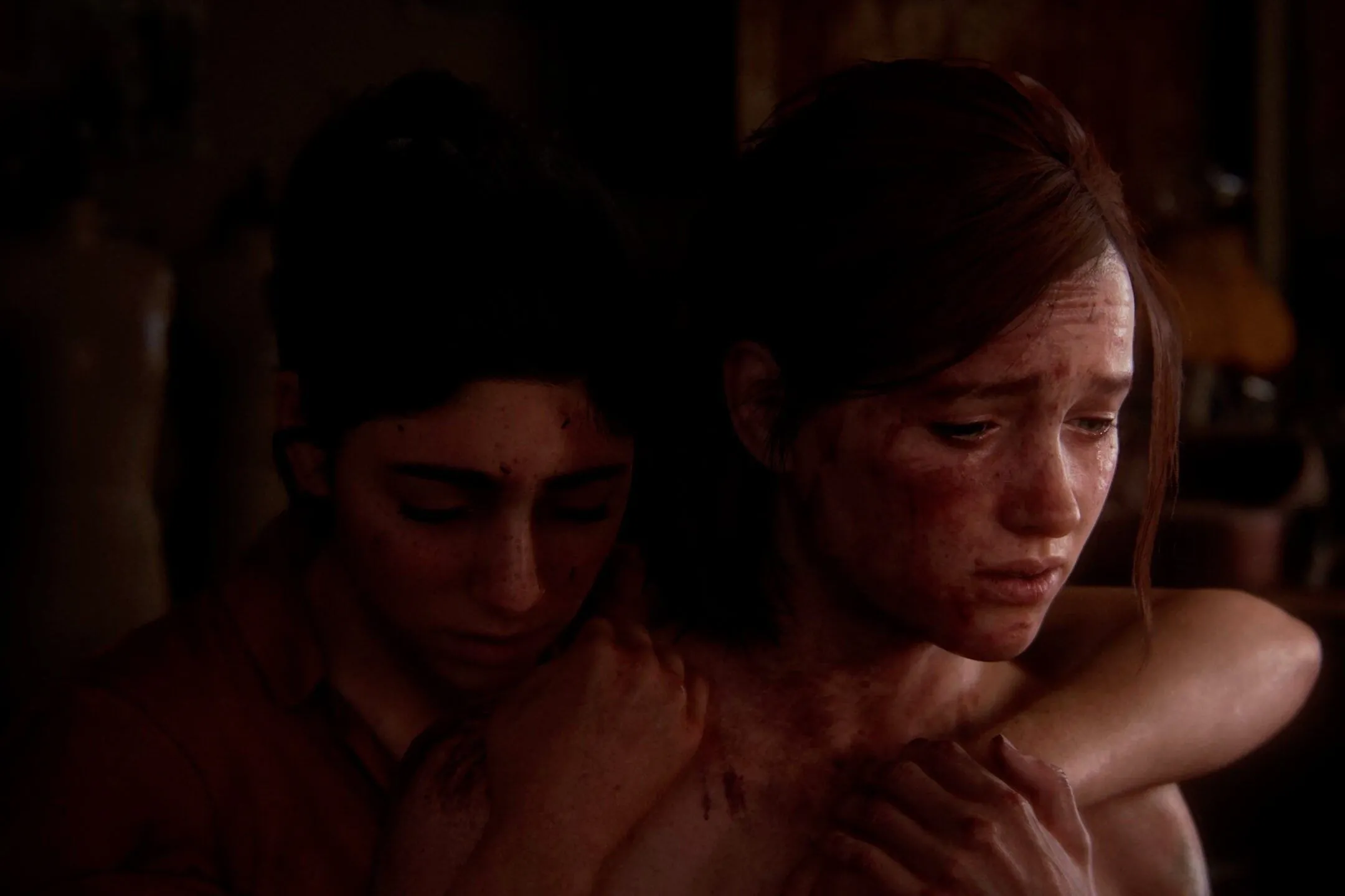 Ellie và Dina ôm nhau trong game The Last of Us Part II.