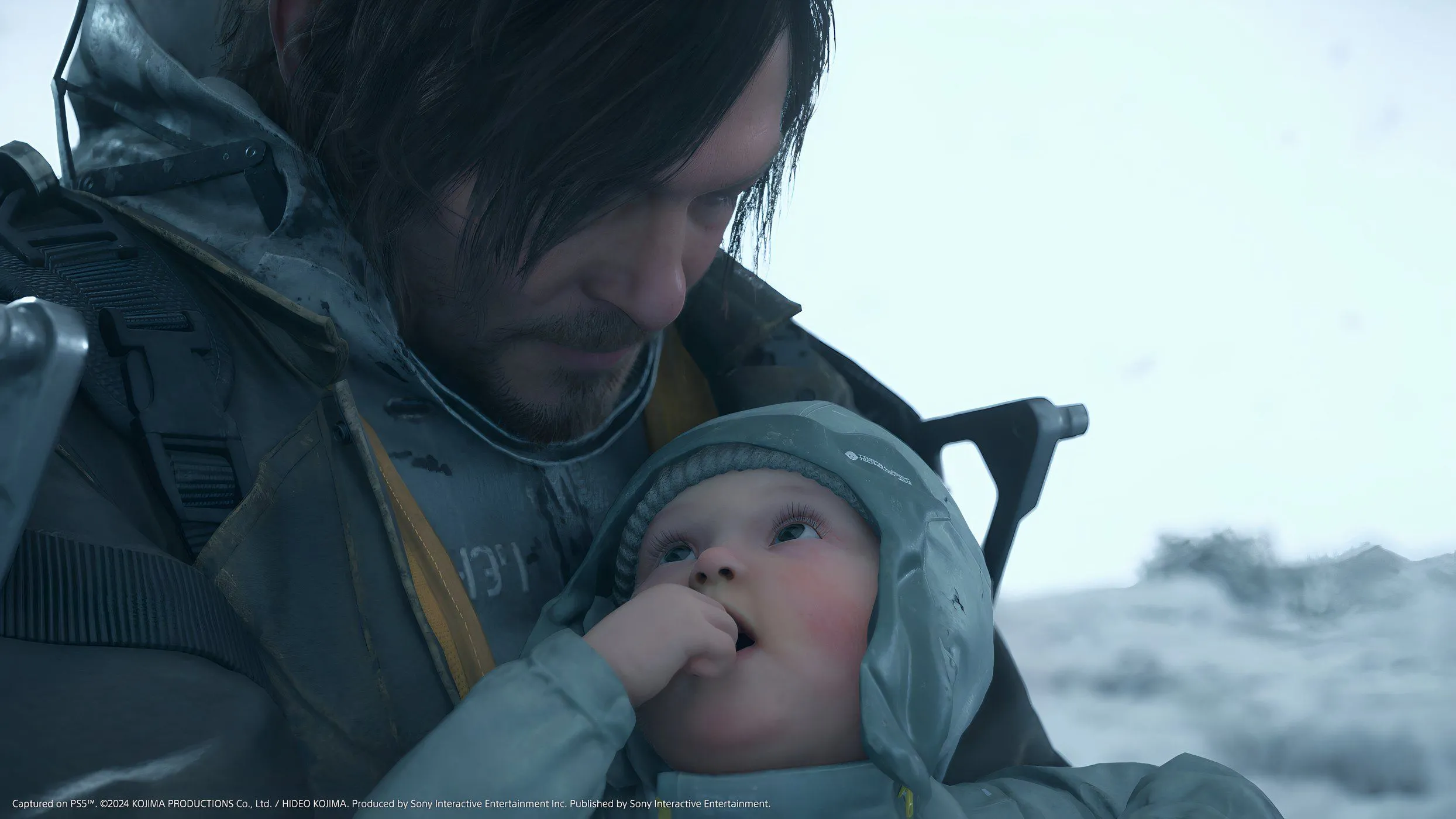 Hình ảnh Sam Porter Bridges và một em bé từ Death Stranding 2: On The Beach