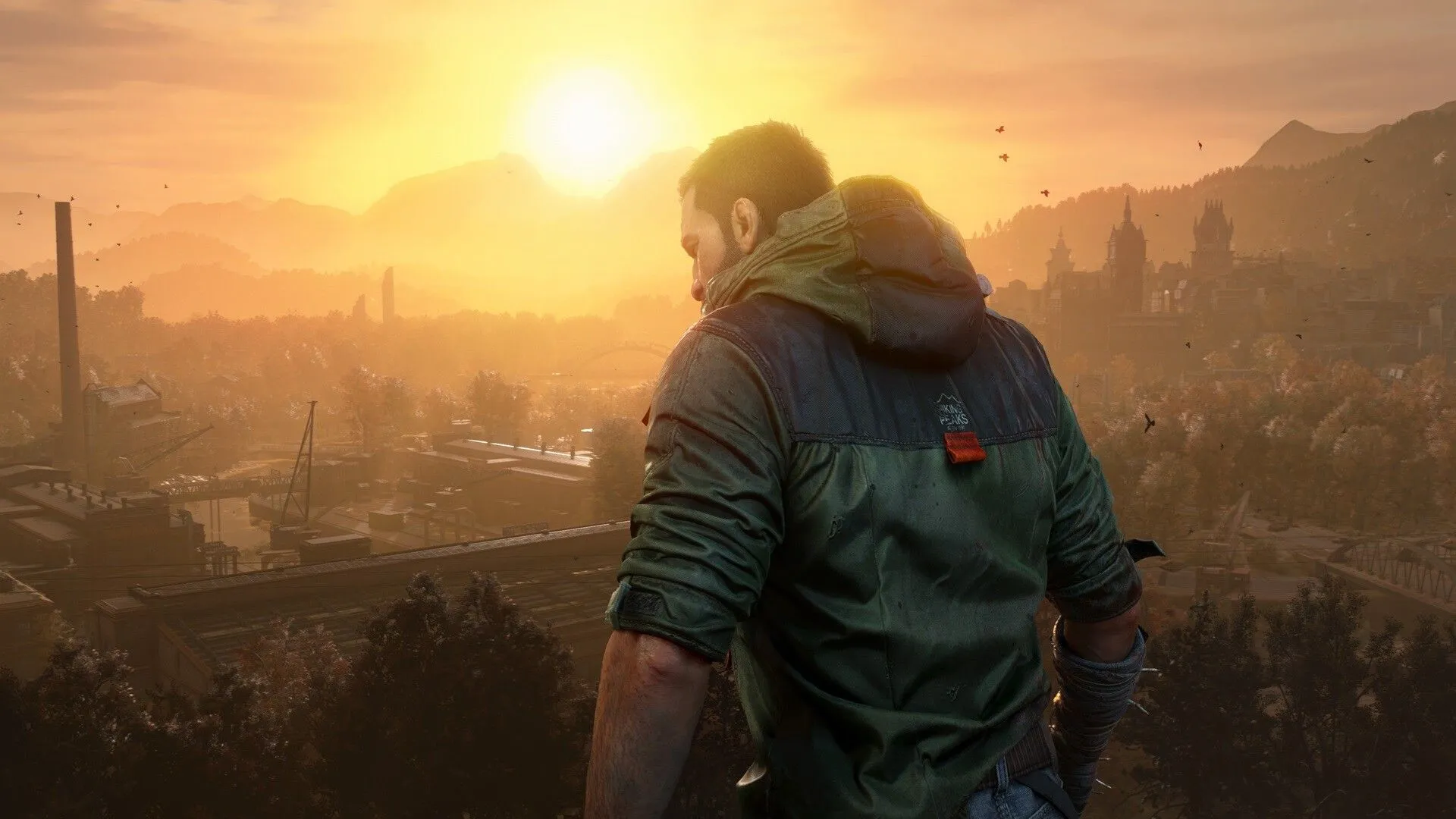 Kyle Crane đứng trên tòa nhà cao tầng, nhìn về phía xa trong Dying Light: The Beast