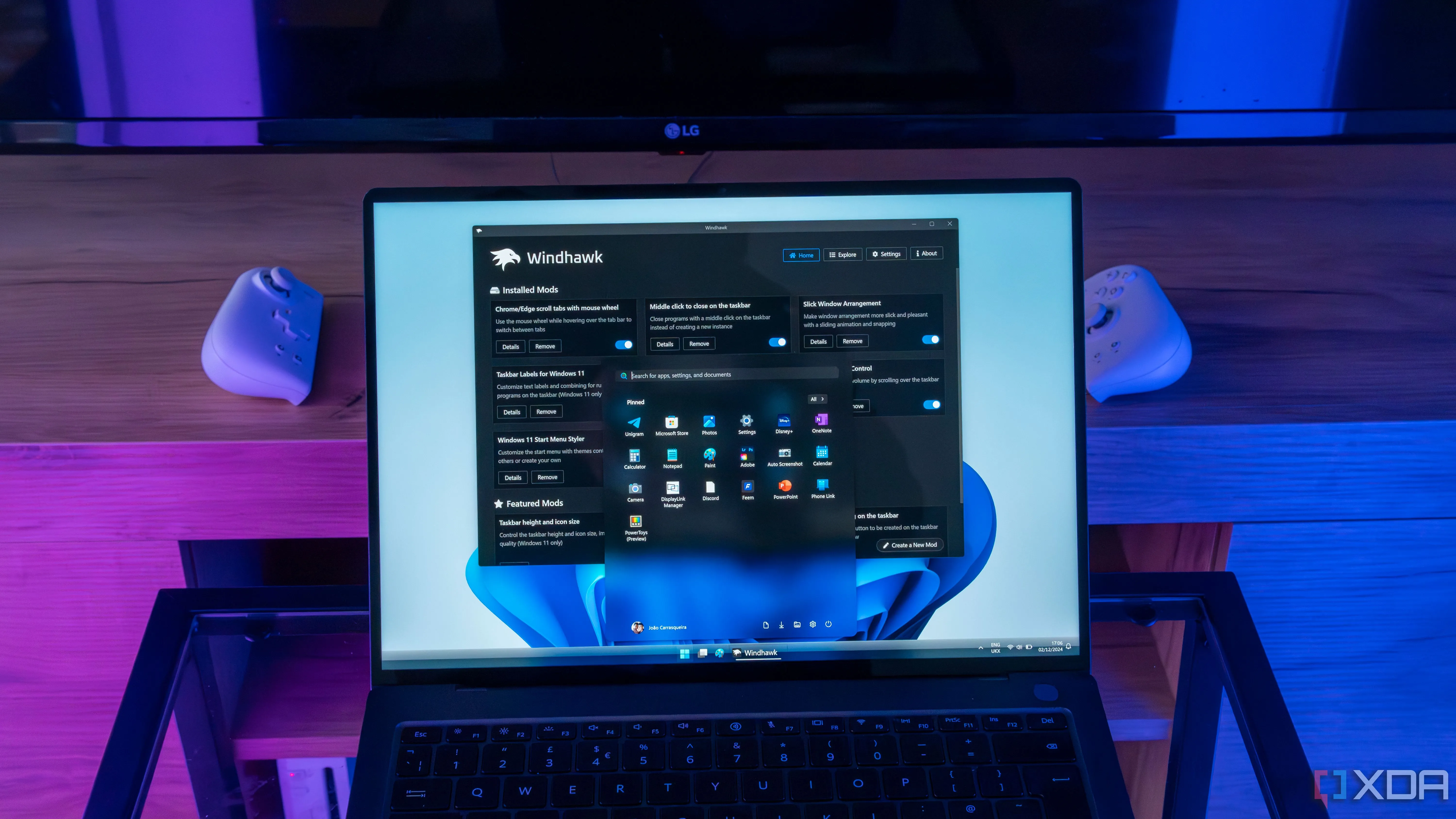 Laptop Windows 11 với Windhawk đang tùy chỉnh Start menu và thanh tác vụ