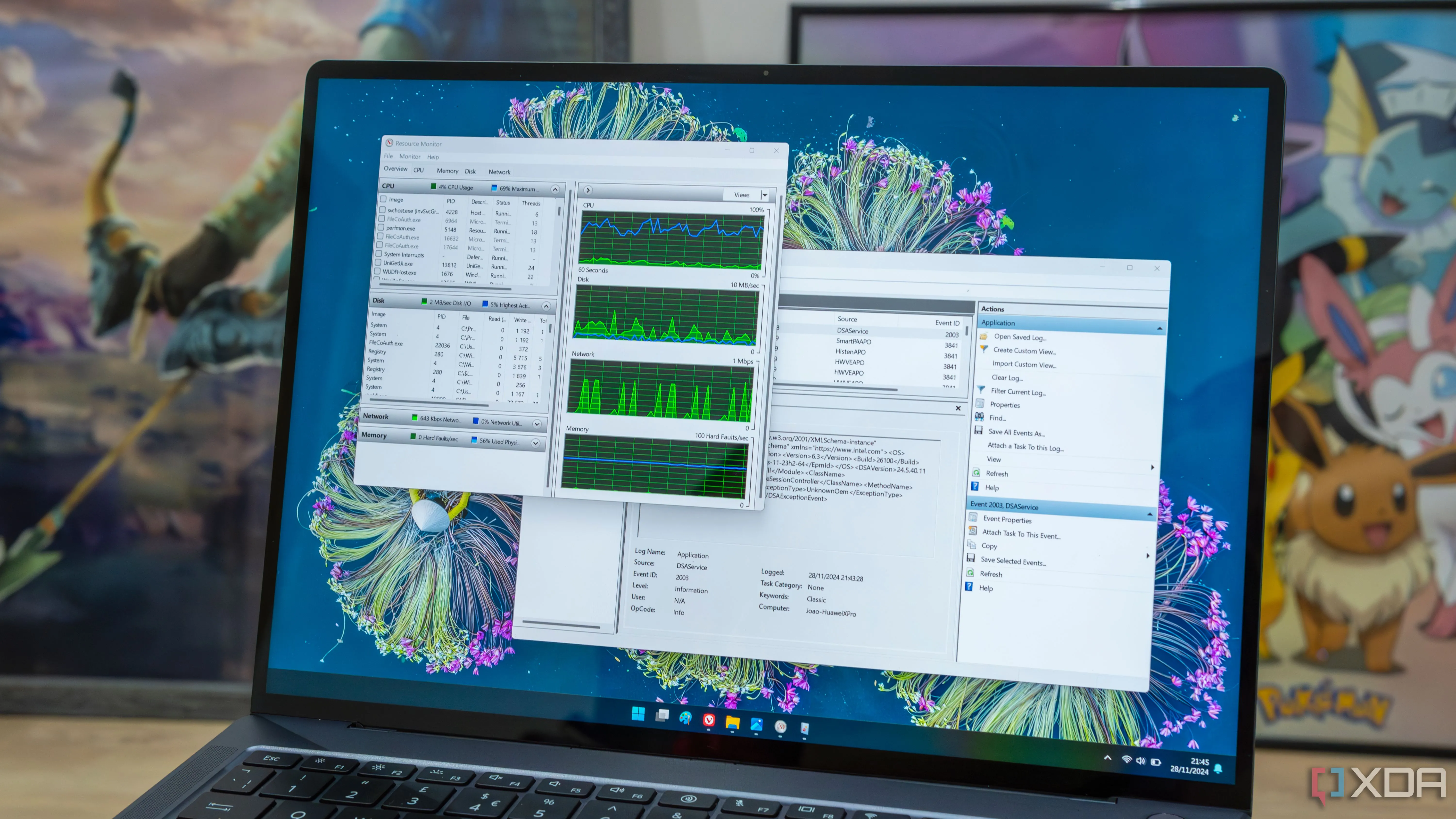 Máy tính xách tay Windows 11 hiển thị giao diện các công cụ Resource Monitor và Event Viewer