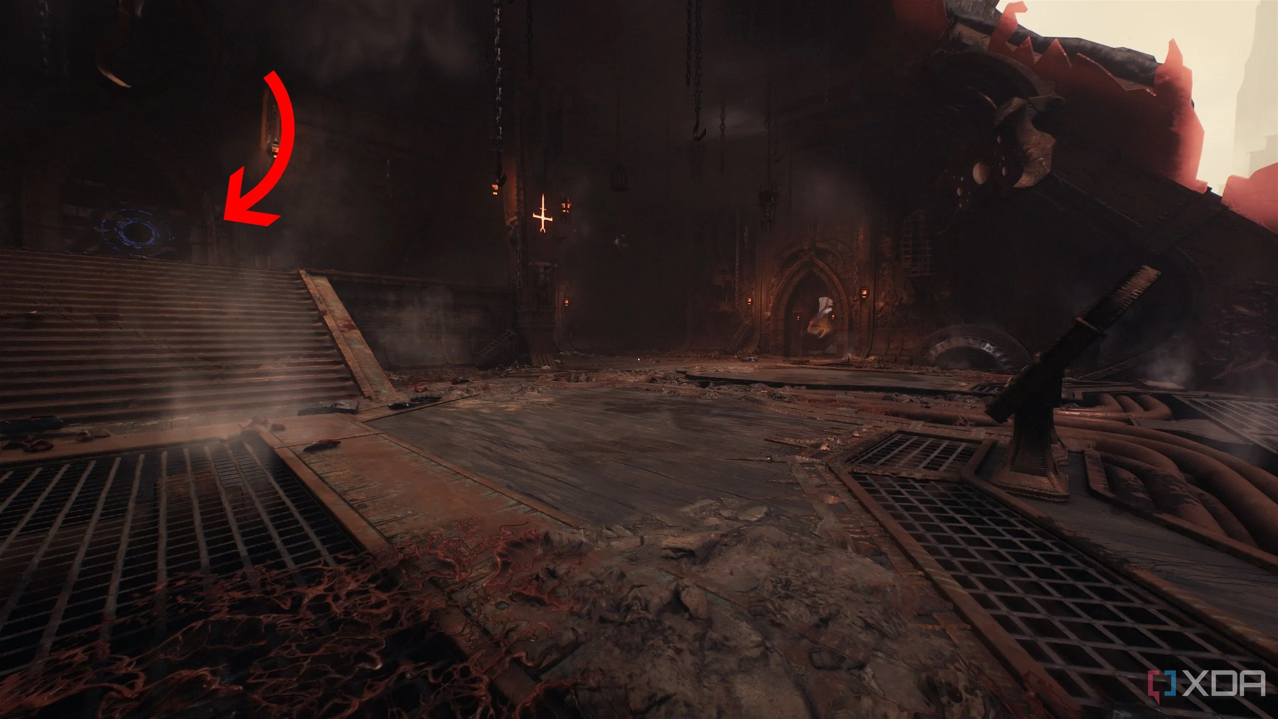 Mũi tên chỉ vào bức tường gỗ Shield Bash trong con tàu Hell Carrier bị rơi của Doom: The Dark Ages