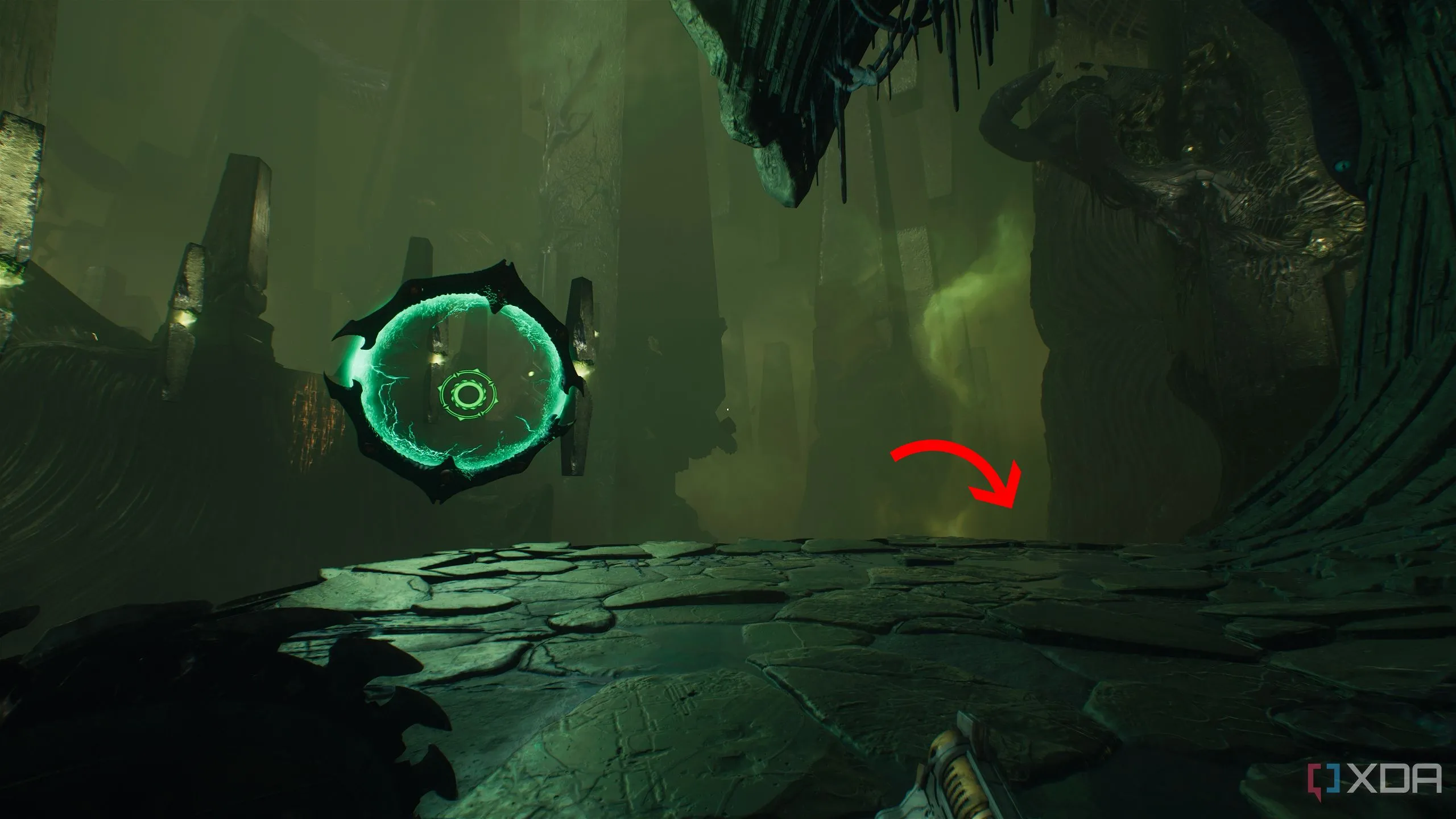 Mũi tên chỉ xuống bên phải cổng Shield Portal trong Chương 15 Doom The Dark Ages.