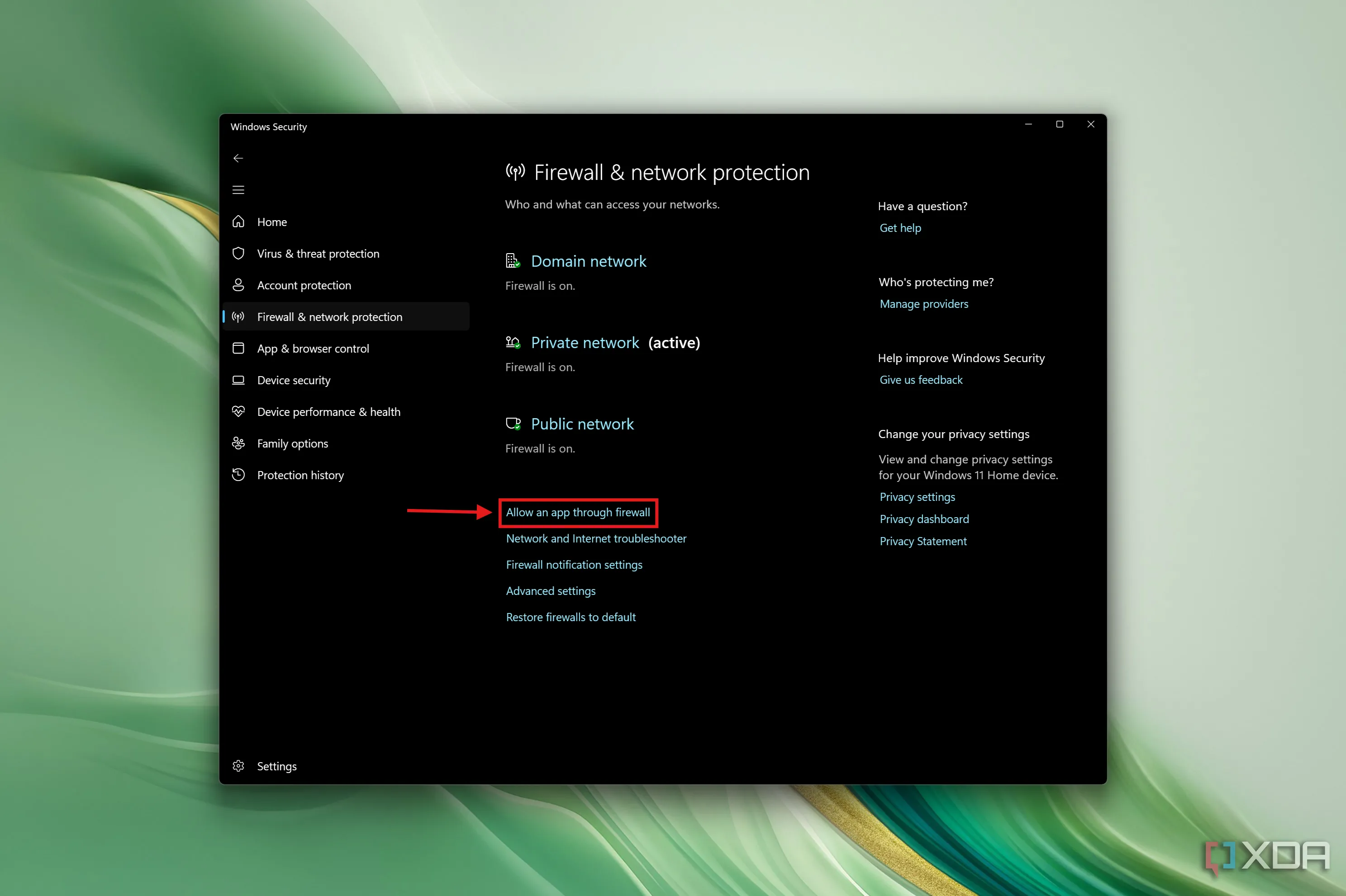Windows Security với nút &quot;Allow an app through firewall&quot; được làm nổi bật